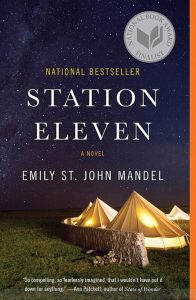 Emily St. John Mandel's "Station Eleven" book cover. Large tents under a starry sky.